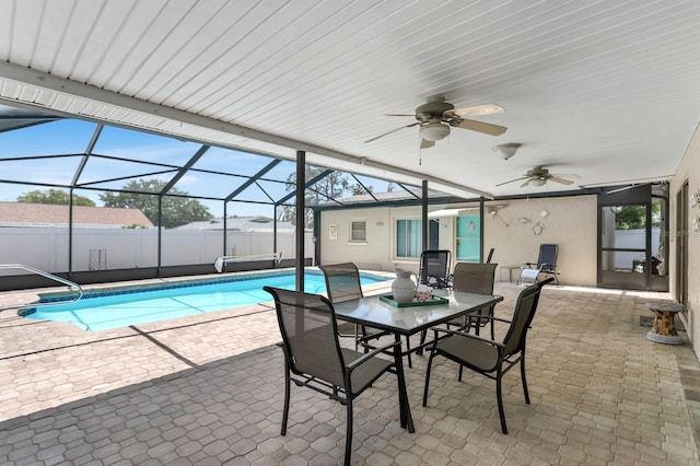 1403 Garden Ave, Tarpon Springs, FL 34689 - view of pool with ceiling fan, a patio, fence, outdoor dining area, and glass enclosure