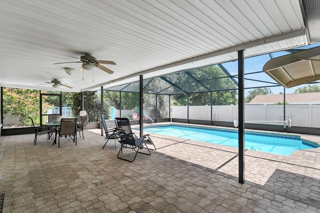 1403 Garden Ave, Tarpon Springs, FL 34689 - view of swimming pool featuring a fenced backyard, a patio area, ceiling fan, and outdoor dining area
