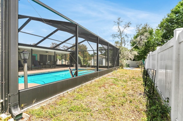 1403 Garden Ave, Tarpon Springs, FL 34689 - view of pool featuring ceiling fan and a lanai
