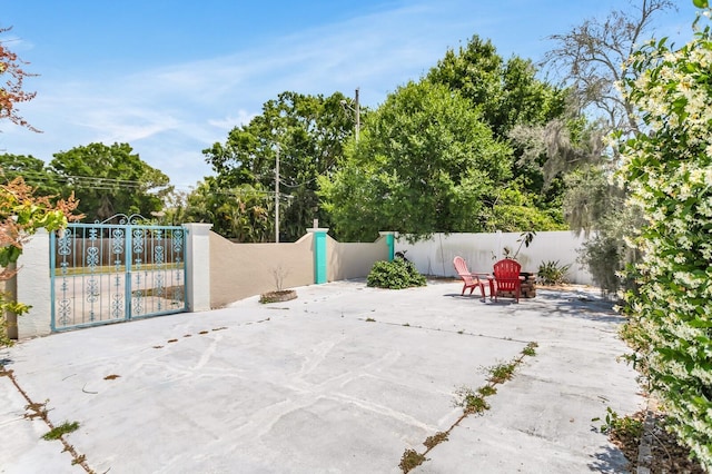 1403 Garden Ave, Tarpon Springs, FL 34689 - view of patio with fence and view of scattered trees
