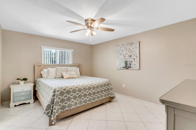 1403 Garden Ave, Tarpon Springs, FL 34689 - bedroom with ceiling fan, light tile patterned flooring, and baseboards
