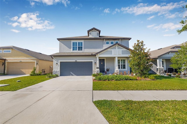 4808 Jackson Club Loop, Tampa, FL 33624 - view of front of property featuring stucco siding, concrete driveway, a front yard, and a garage