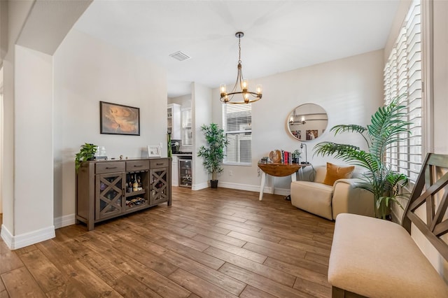 4808 Jackson Club Loop, Tampa, FL 33624 - living room with wood-type flooring, a chandelier, and beverage cooler