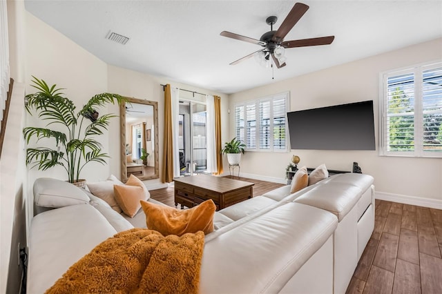 4808 Jackson Club Loop, Tampa, FL 33624 - living room featuring plenty of natural light, dark wood-style flooring, and ceiling fan