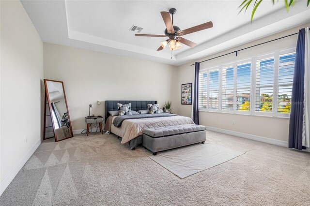 4808 Jackson Club Loop, Tampa, FL 33624 - bedroom featuring a tray ceiling, carpet, and ceiling fan