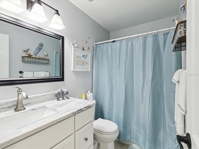 bathroom with toilet, curtained shower, and vanity