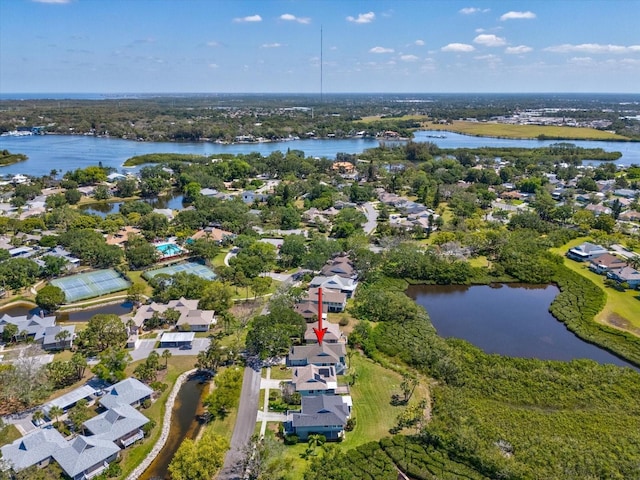 drone / aerial view featuring a water view and a residential view