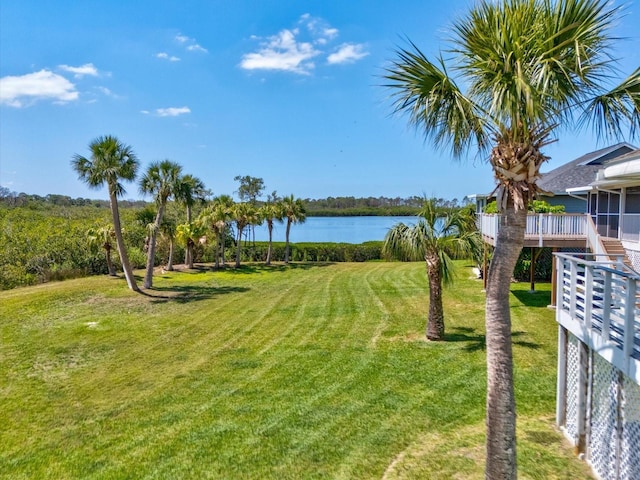 view of yard featuring a deck with water view