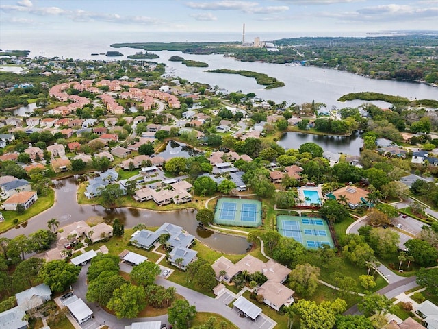 birds eye view of property with a residential view and a water view