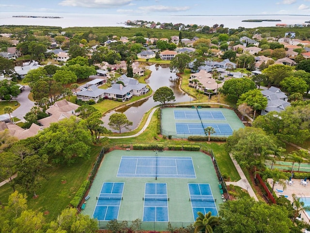 birds eye view of property with a residential view and a water view