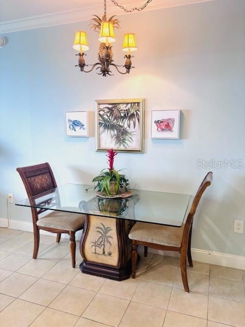 13415 Blue Heron Beach Dr Unit 1006, Orlando, FL 32821 - dining space with baseboards, ornamental molding, light tile patterned flooring, and a notable chandelier