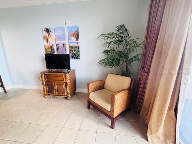 13415 Blue Heron Beach Dr Unit 1006, Orlando, FL 32821 - sitting room with baseboards and light tile patterned floors