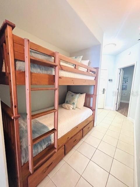 13415 Blue Heron Beach Dr Unit 1006, Orlando, FL 32821 - bedroom featuring light tile patterned floors