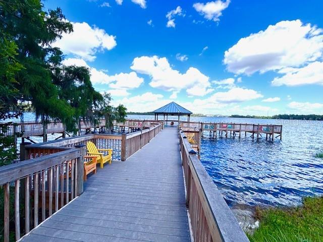 13415 Blue Heron Beach Dr Unit 1006, Orlando, FL 32821 - dock area featuring a water view and a gazebo