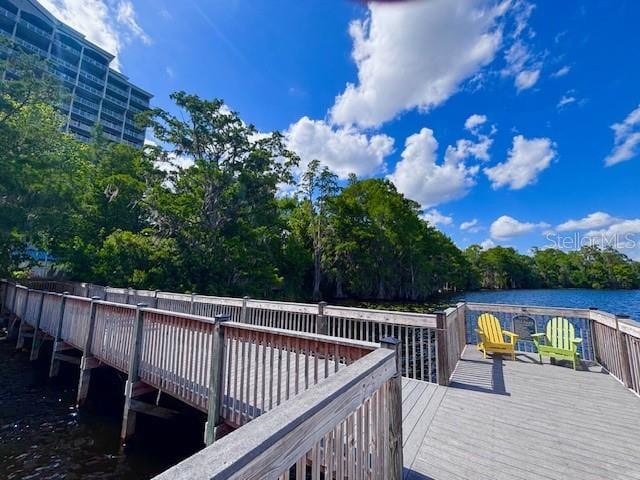 13415 Blue Heron Beach Dr Unit 1006, Orlando, FL 32821 - view of dock featuring a deck with water view