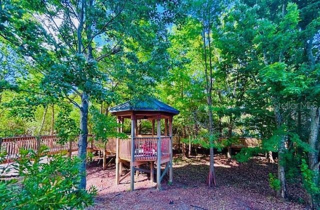 13415 Blue Heron Beach Dr Unit 1006, Orlando, FL 32821 - view of play area featuring a gazebo and fence