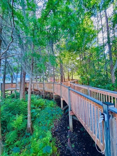 13415 Blue Heron Beach Dr Unit 1006, Orlando, FL 32821 - exterior space with a deck and fence