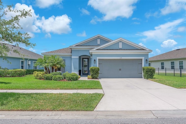 single story home featuring fence, a front lawn, a garage, stucco siding, and concrete driveway