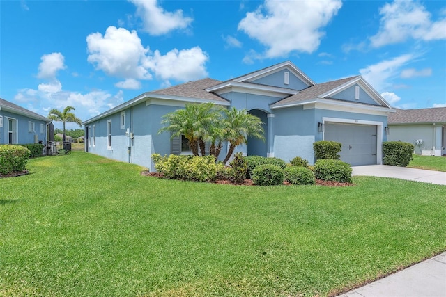 ranch-style home featuring a garage, a front lawn, concrete driveway, a shingled roof, and stucco siding