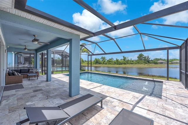 pool with an outdoor living space, a water view, a ceiling fan, and a patio
