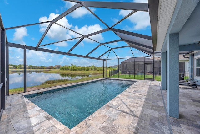 pool featuring a water view, a lanai, and a patio