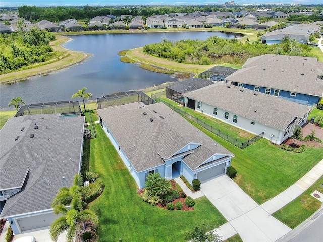 birds eye view of property featuring a residential view and a water view