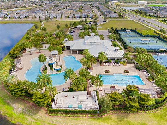 drone / aerial view featuring a water view and a residential view
