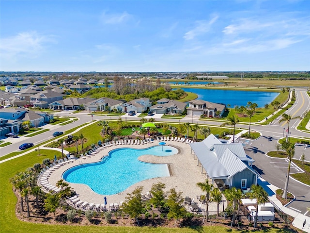 aerial view featuring a residential view and a water view