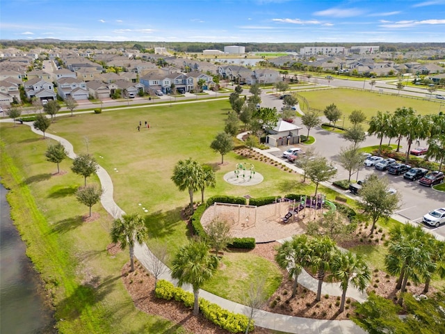 birds eye view of property with a residential view