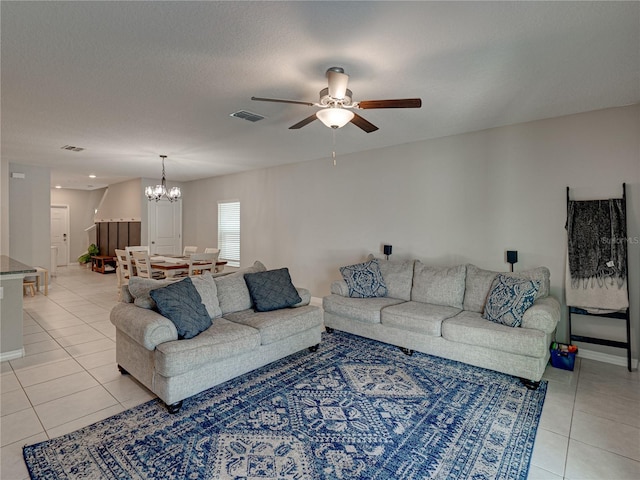 413 Royal Empress Dr, Ruskin, FL 33570 - living area with light tile patterned floors, a chandelier, and a ceiling fan
