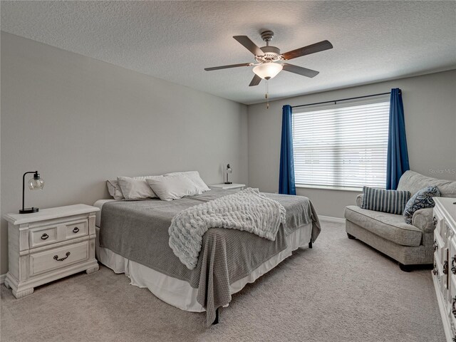 413 Royal Empress Dr, Ruskin, FL 33570 - bedroom featuring light colored carpet, a textured ceiling, a ceiling fan, and baseboards