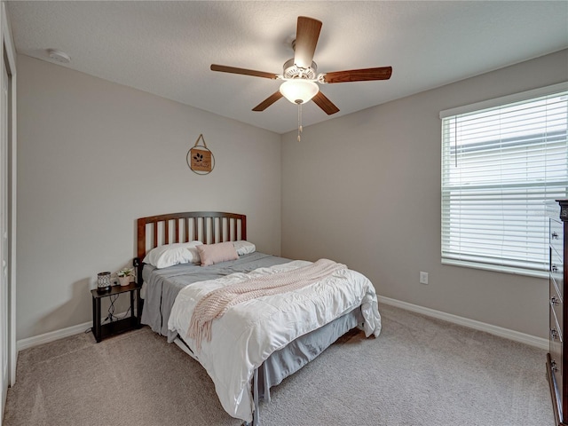 413 Royal Empress Dr, Ruskin, FL 33570 - bedroom with light carpet, baseboards, and ceiling fan