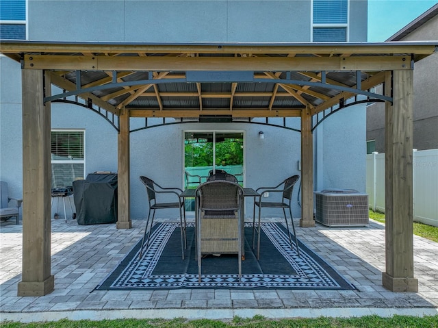 413 Royal Empress Dr, Ruskin, FL 33570 - view of patio / terrace featuring a gazebo, fence, central air condition unit, and outdoor dining space