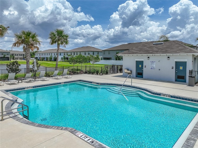 413 Royal Empress Dr, Ruskin, FL 33570 - community pool with a patio, a residential view, and fence