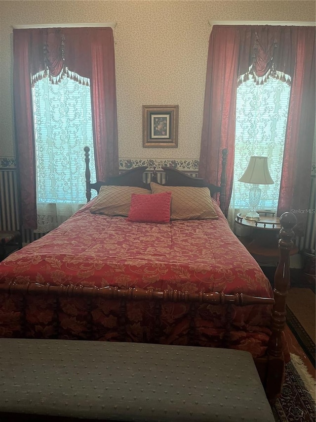 bedroom with multiple windows