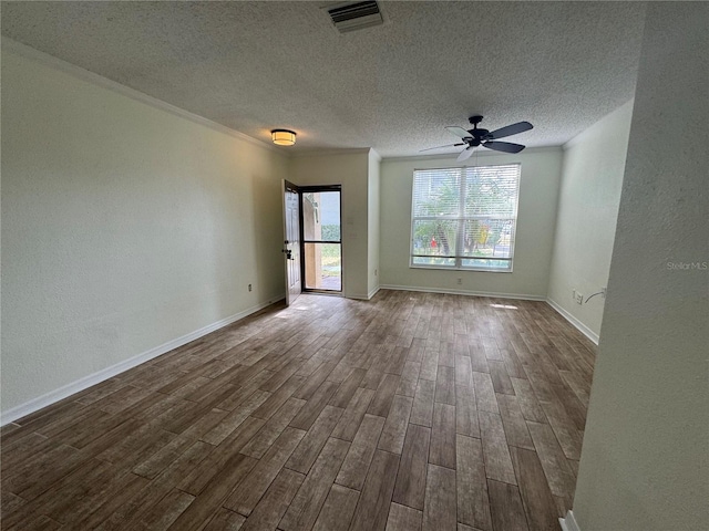 6405 Osprey Lake Cir, Riverview, FL 33578 - unfurnished room featuring visible vents, baseboards, dark wood-type flooring, a textured ceiling, and a ceiling fan