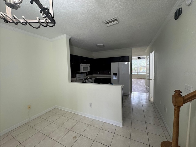 6405 Osprey Lake Cir, Riverview, FL 33578 - kitchen featuring white appliances, visible vents, ornamental molding, and light tile patterned floors