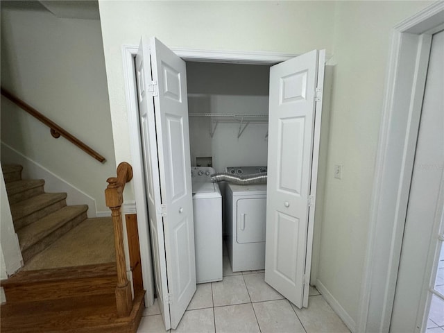 6405 Osprey Lake Cir, Riverview, FL 33578 - laundry area featuring separate washer and dryer, baseboards, laundry area, and light tile patterned flooring