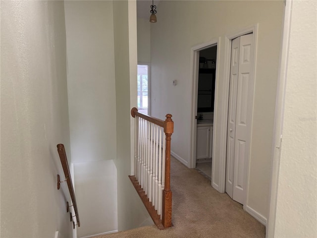 6405 Osprey Lake Cir, Riverview, FL 33578 - hall featuring baseboards, an upstairs landing, and light carpet