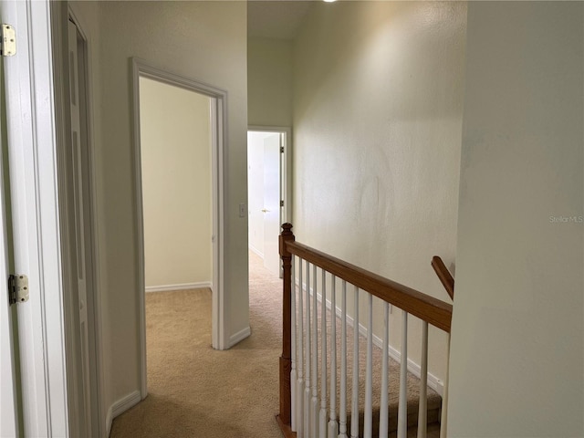 6405 Osprey Lake Cir, Riverview, FL 33578 - hallway featuring baseboards, an upstairs landing, and carpet
