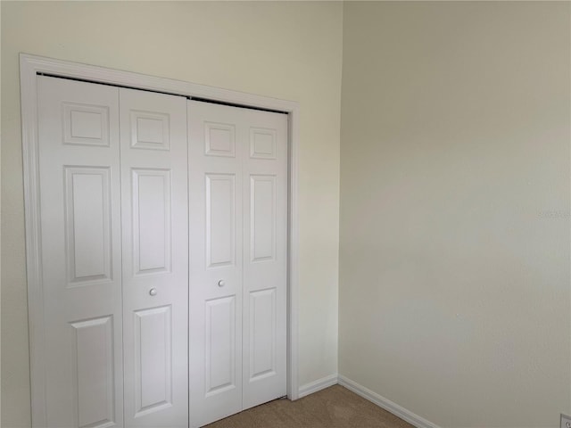 6405 Osprey Lake Cir, Riverview, FL 33578 - unfurnished bedroom with carpet flooring, baseboards, and a closet