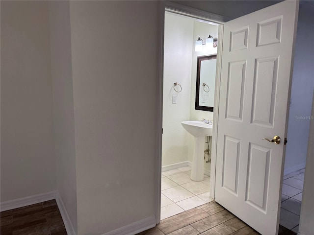 6405 Osprey Lake Cir, Riverview, FL 33578 - bathroom featuring baseboards and wood finished floors