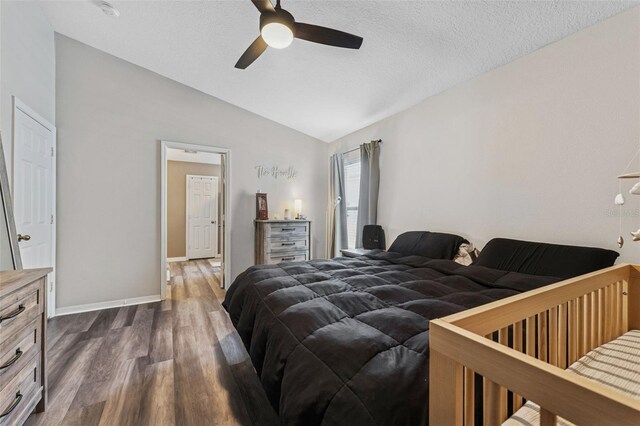 518 Royal Ridge St, Valrico, FL 33594 - bedroom featuring a textured ceiling, a ceiling fan, baseboards, lofted ceiling, and dark wood-style floors