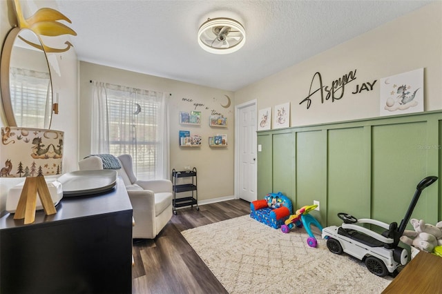 518 Royal Ridge St, Valrico, FL 33594 - rec room featuring a textured ceiling and dark wood finished floors