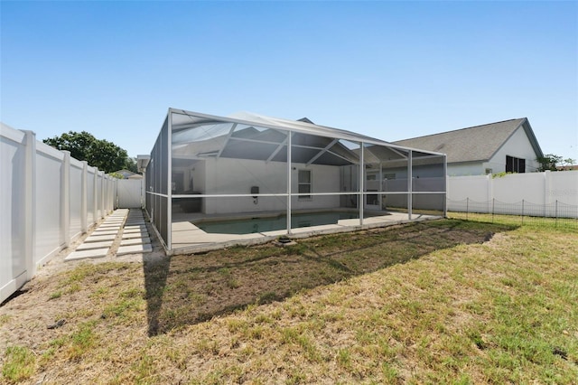 518 Royal Ridge St, Valrico, FL 33594 - back of house featuring a yard, a patio, a fenced backyard, and glass enclosure
