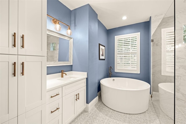 full bath featuring baseboards, a soaking tub, tile patterned floors, and vanity