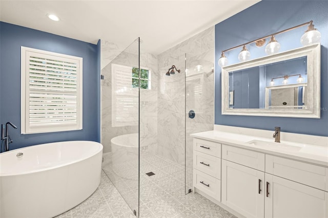 bathroom with vanity, walk in shower, and a freestanding bath