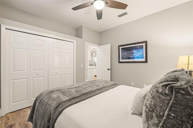 bedroom with visible vents, a ceiling fan, a closet, and light wood-type flooring