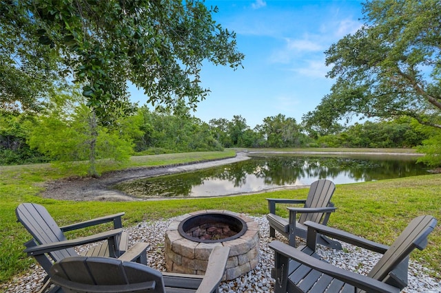 view of patio / terrace with a water view and a fire pit