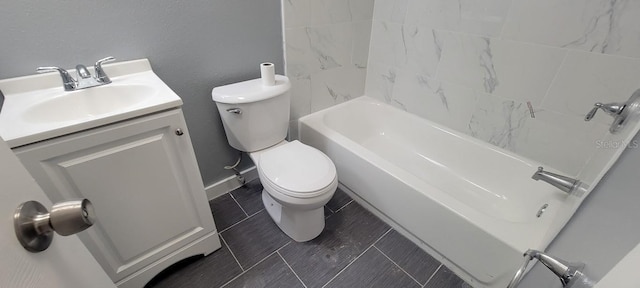 bathroom featuring vanity, baseboards, toilet, and  shower combination